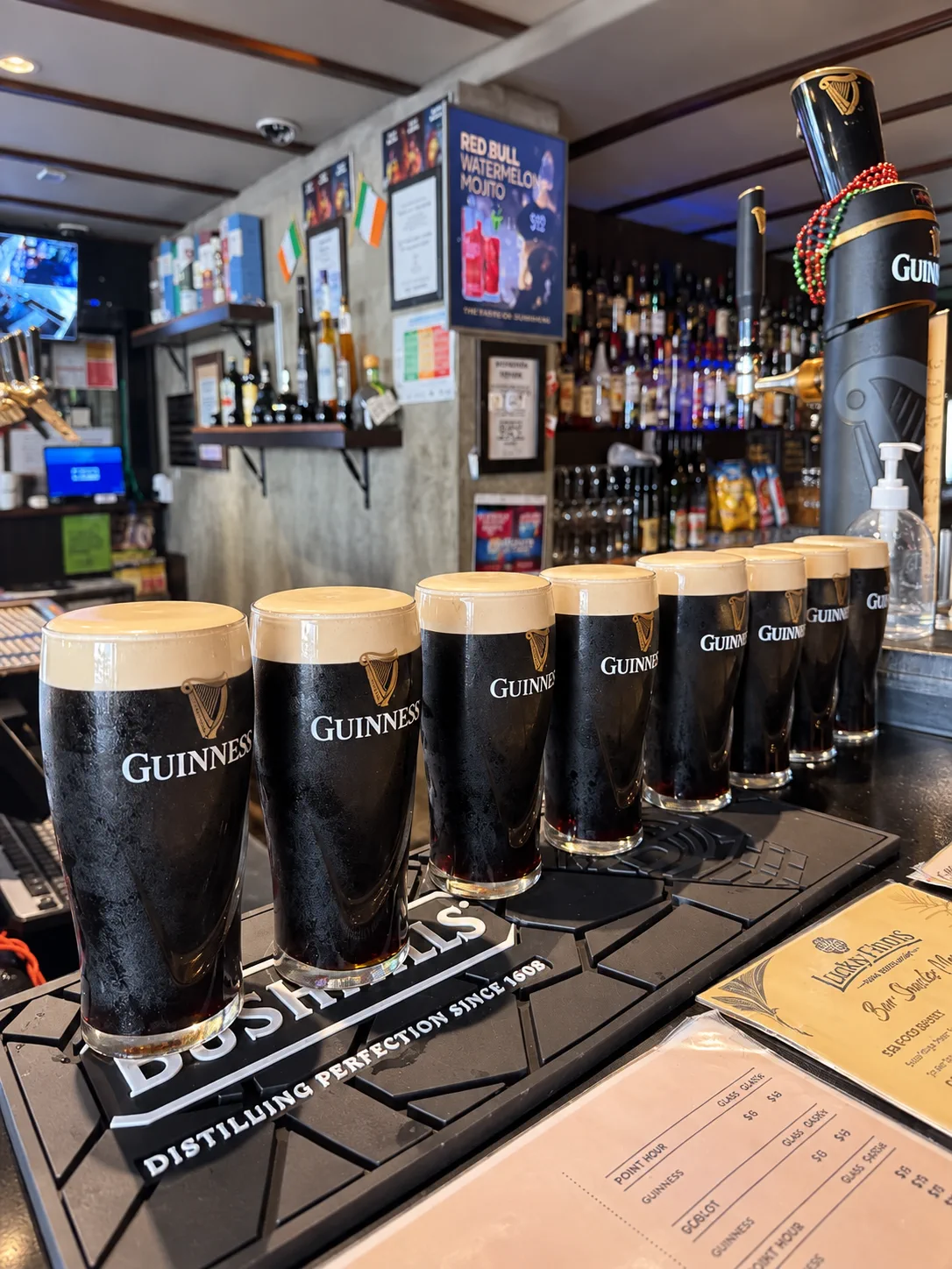 Pints of Guinness lined up at the Lucky Finns bar